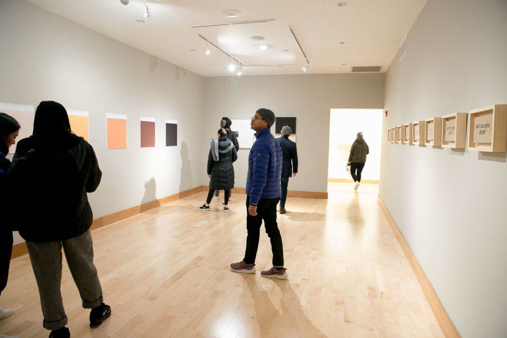 Same gallery view but with people in the space