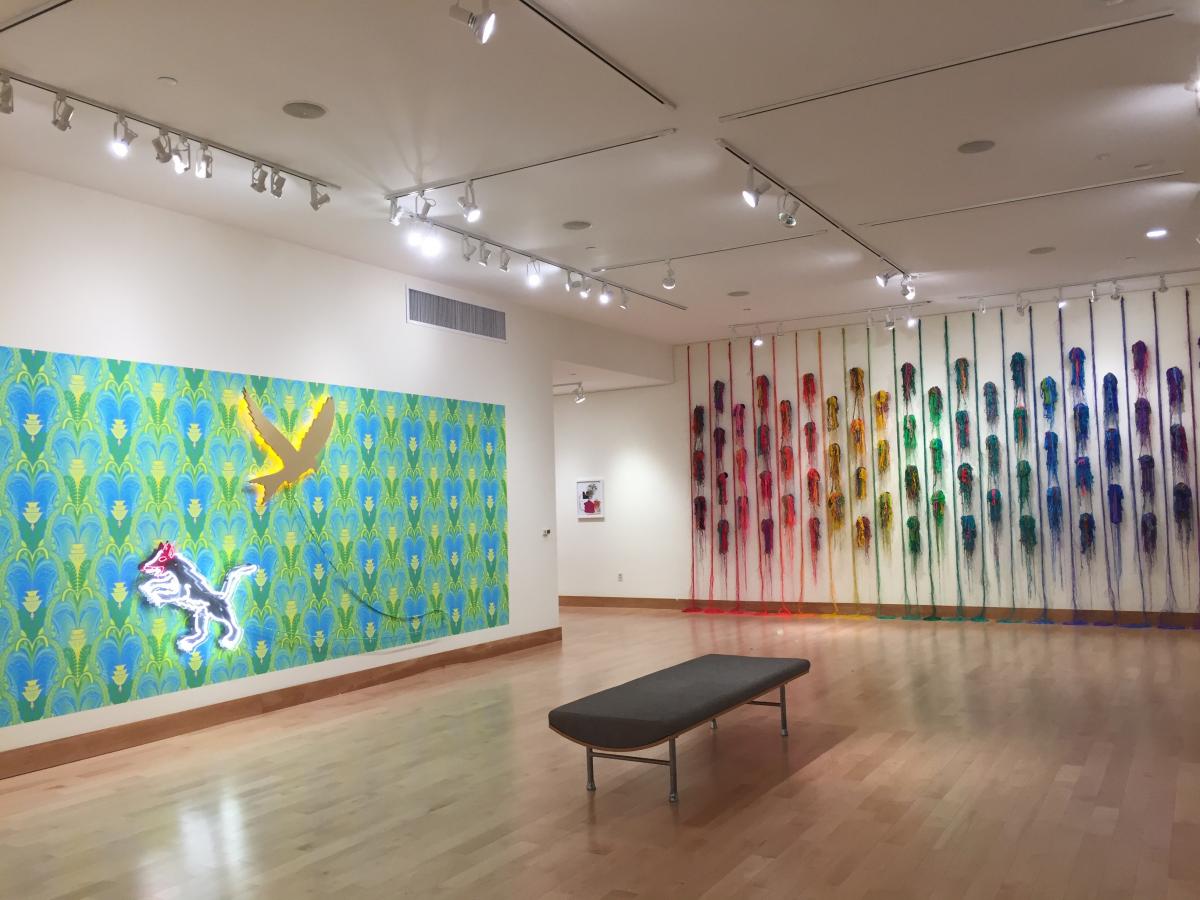 Gallery view with two wall pieces in the frame